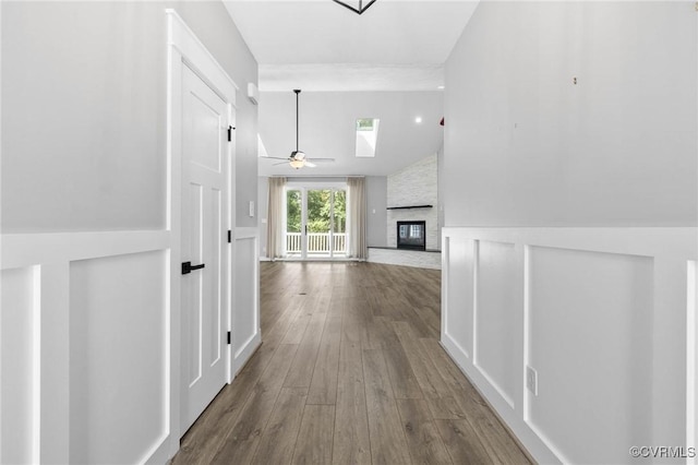 3130 Tinsley Ter, Prince George, VA 23875 - hallway featuring wood finished floors, lofted ceiling, and wainscoting
