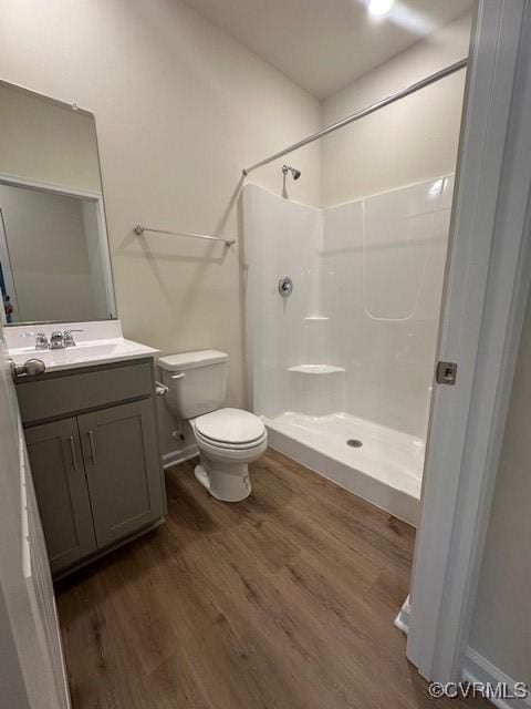 7079 Hepworth Dr, Henrico, VA 23231 - full bath featuring wood finished floors, vanity, and a shower