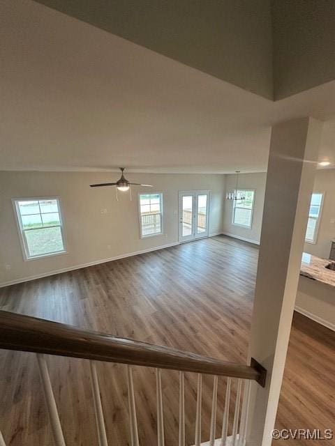 7079 Hepworth Dr, Henrico, VA 23231 - unfurnished living room featuring wood finished floors, healthy amount of natural light, and ceiling fan
