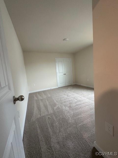 7079 Hepworth Dr, Henrico, VA 23231 - carpeted empty room with baseboards