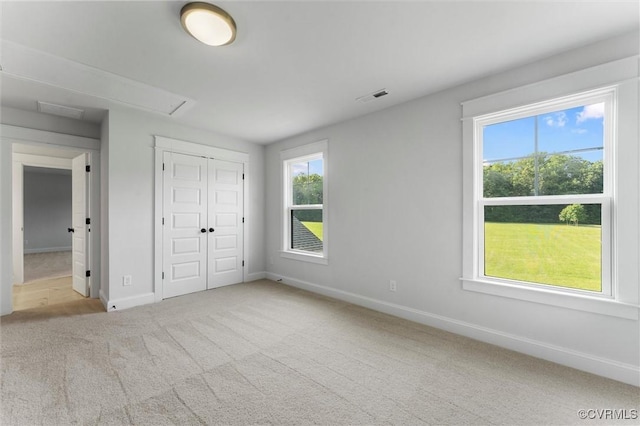 3616 Bonnies Way, Powhatan, VA 23139 - unfurnished bedroom with multiple windows, carpet floors, a closet, and attic access