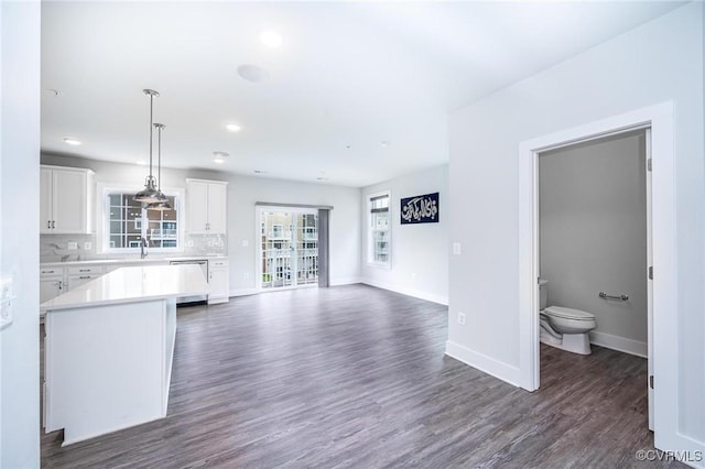 4357 Saunders Station Loop Unit B, Henrico, VA 23233 - kitchen featuring stainless steel dishwasher, light countertops, white cabinets, dark wood finished floors, and recessed lighting