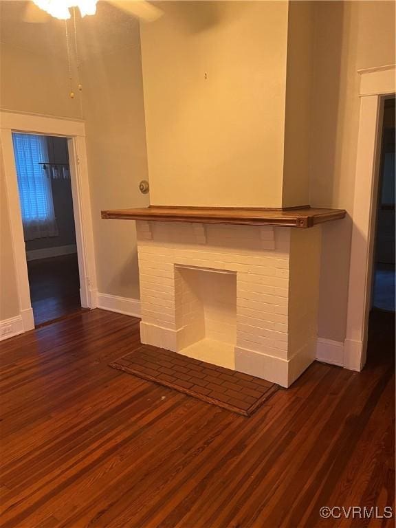 817 Lafayette Ave, Colonial Heights, VA 23834 - unfurnished living room featuring dark wood finished floors and a brick fireplace