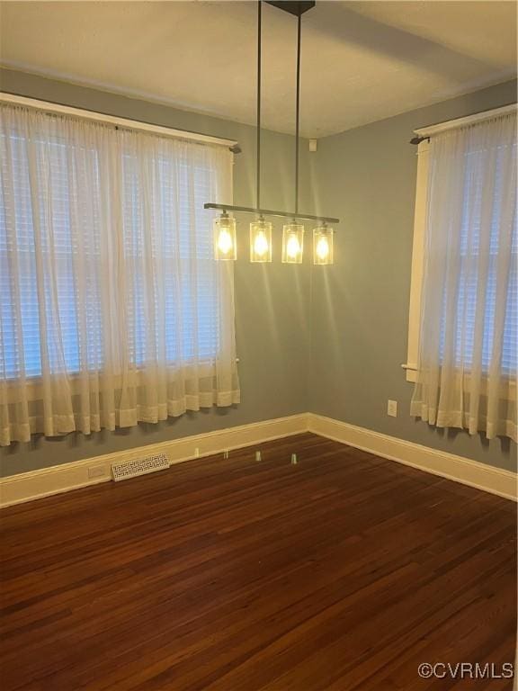 817 Lafayette Ave, Colonial Heights, VA 23834 - unfurnished dining area with wood finished floors and baseboards