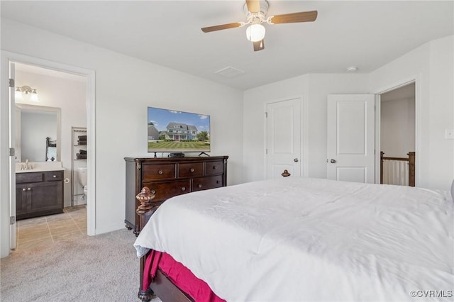 17018 Westervelt Ct, Chesterfield, VA 23120 - bedroom with connected bathroom, light carpet, and a ceiling fan