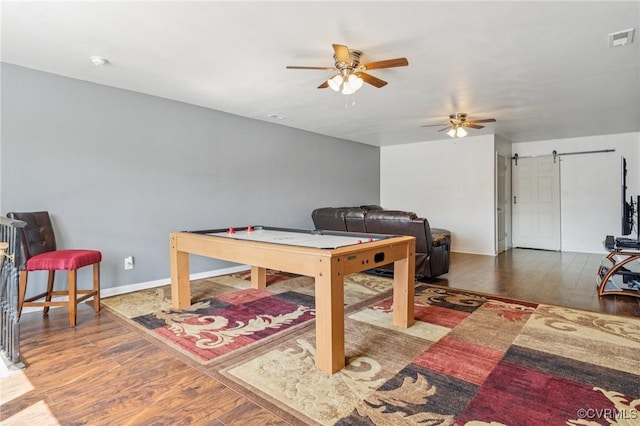 17018 Westervelt Ct, Chesterfield, VA 23120 - playroom featuring a ceiling fan, wood finished floors, and a barn door