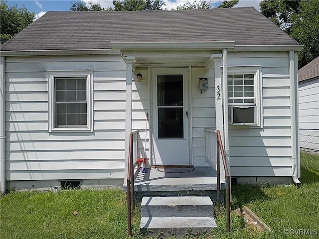 32 Seaboard St, Petersburg, VA 23803 - entrance to property featuring roof with shingles and a yard