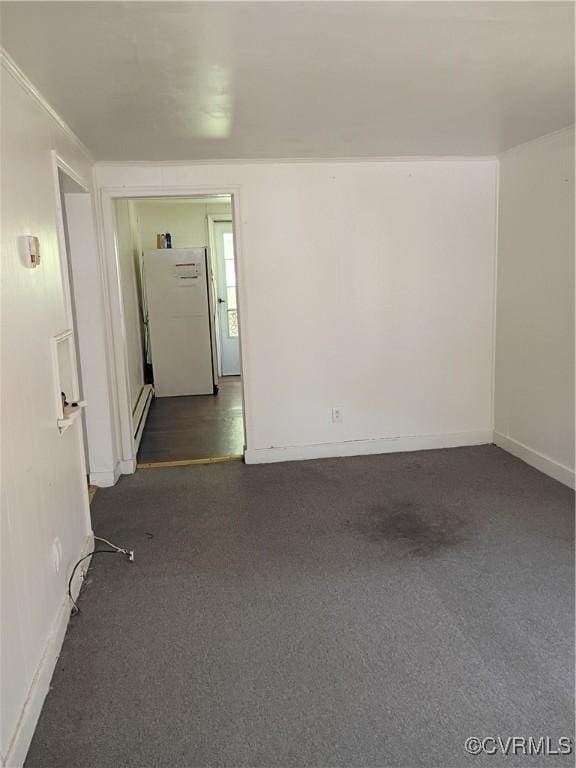 32 Seaboard St, Petersburg, VA 23803 - spare room with baseboard heating and dark carpet