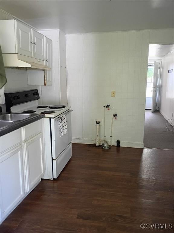 32 Seaboard St, Petersburg, VA 23803 - kitchen with electric stove, dark wood-type flooring, dark countertops, under cabinet range hood, and white cabinetry
