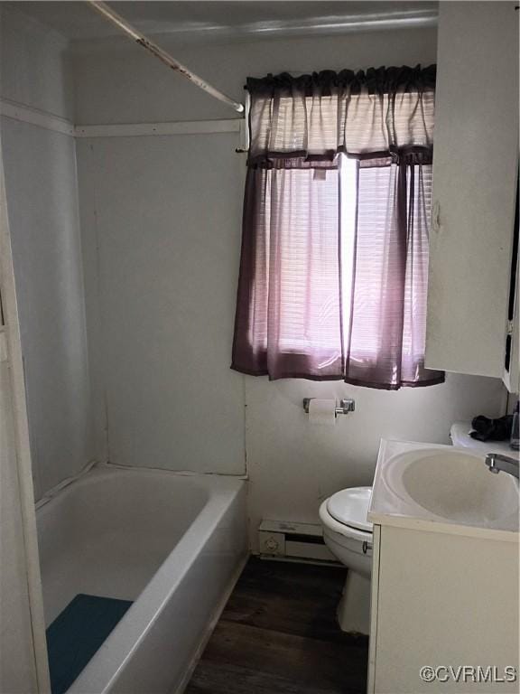 32 Seaboard St, Petersburg, VA 23803 - bathroom with baseboard heating, wood finished floors, and vanity
