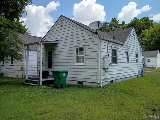 32 Seaboard St, Petersburg, VA 23803 - rear view of house featuring crawl space, a lawn, and a shingled roof