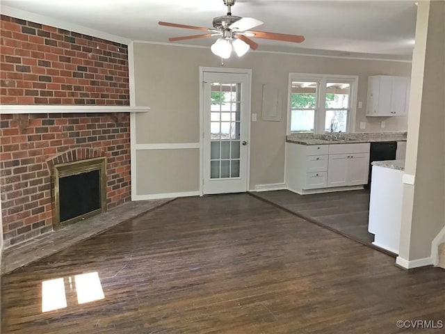 5206 Hallmark Dr, Chesterfield, VA 23234 - unfurnished living room featuring dark wood-style floors, ceiling fan, ornamental molding, and a brick fireplace