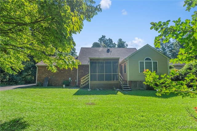 6768 Poplar Woods Ct, Quinton, VA 23141 - back of house featuring a sunroom, a lawn, entry steps, and roof with shingles