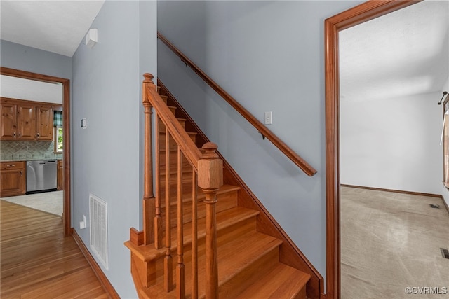 6768 Poplar Woods Ct, Quinton, VA 23141 - stairway featuring baseboards and wood finished floors