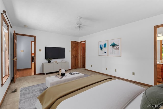 6768 Poplar Woods Ct, Quinton, VA 23141 - bedroom with multiple windows, light colored carpet, ensuite bath, and a ceiling fan