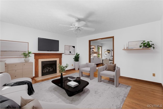 6768 Poplar Woods Ct, Quinton, VA 23141 - living area with wood finished floors, a fireplace with raised hearth, and ceiling fan