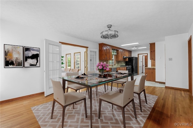 6768 Poplar Woods Ct, Quinton, VA 23141 - dining area with baseboards and light wood finished floors