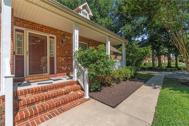 6768 Poplar Woods Ct, Quinton, VA 23141 - doorway to property with brick siding and a porch
