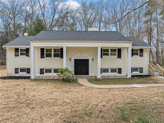 4029 Old Buckingham Rd, Powhatan, VA 23139 - bi-level home featuring brick siding, roof with shingles, and a chimney