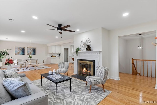 4029 Old Buckingham Rd, Powhatan, VA 23139 - living area featuring light wood-type flooring, ceiling fan, recessed lighting, and a fireplace with flush hearth