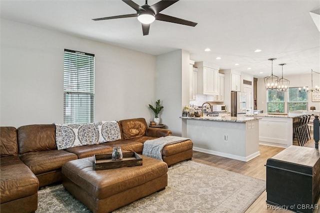 4217 Pillar, Williamsburg, VA 23188 - living area with a ceiling fan, light wood finished floors, recessed lighting, and a chandelier
