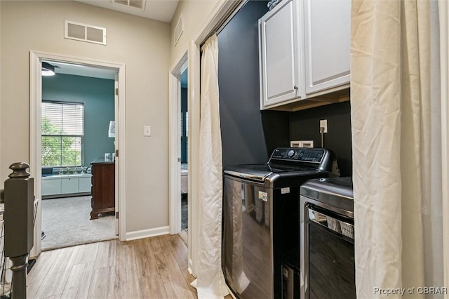 4217 Pillar, Williamsburg, VA 23188 - laundry room with cabinet space, separate washer and dryer, and light wood-type flooring