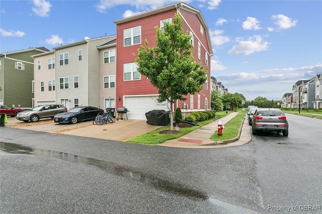 4217 Pillar, Williamsburg, VA 23188 - view of property with an attached garage, a residential view, and driveway