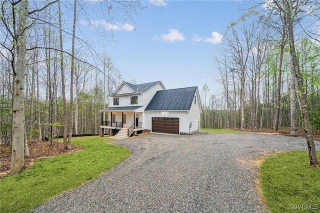 2467 Judes Ferry Rd, Powhatan, VA 23139 - modern inspired farmhouse featuring a porch, gravel driveway, an attached garage, a front lawn, and roof with shingles