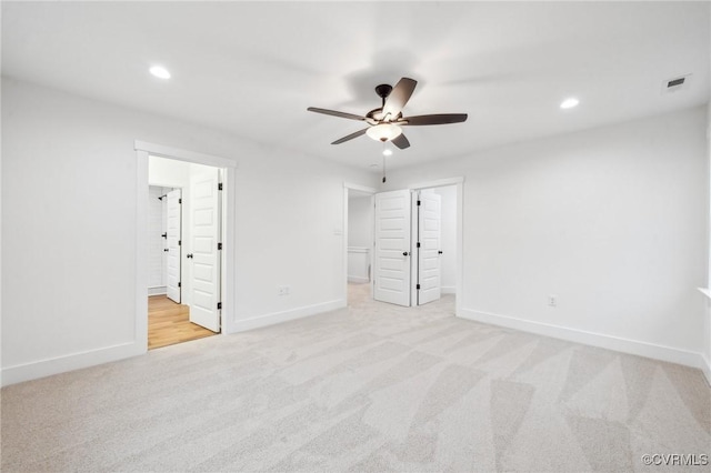 2467 Judes Ferry Rd, Powhatan, VA 23139 - unfurnished bedroom featuring light colored carpet, recessed lighting, ensuite bath, a walk in closet, and a ceiling fan