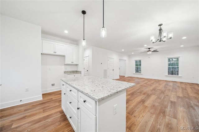 2467 Judes Ferry Rd, Powhatan, VA 23139 - kitchen with a chandelier, light wood-style flooring, white cabinets, recessed lighting, and hanging light fixtures