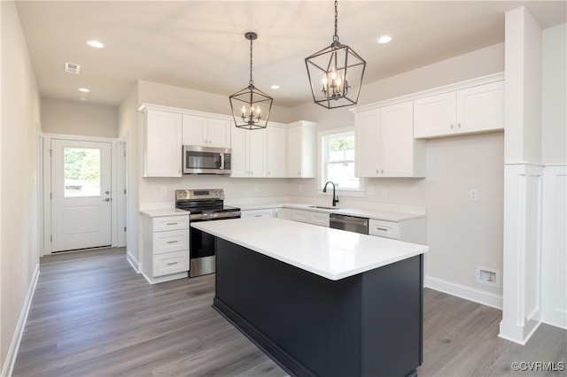 706 S Main St, Blackstone, VA 22824 - kitchen with stainless steel appliances, a chandelier, plenty of natural light, white cabinets, and recessed lighting