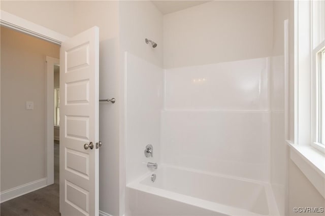 706 S Main St, Blackstone, VA 22824 - bathroom featuring washtub / shower combination and wood finished floors