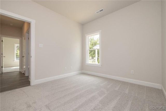 706 S Main St, Blackstone, VA 22824 - carpeted spare room with plenty of natural light and lofted ceiling