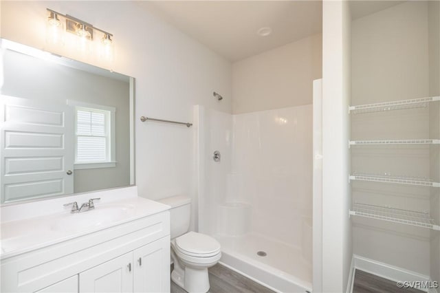 706 S Main St, Blackstone, VA 22824 - full bathroom featuring a shower, vanity, and wood finished floors