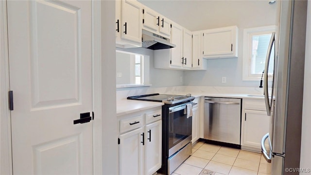 7816 Camolin Ct, Henrico, VA 23228 - kitchen featuring appliances with stainless steel finishes, under cabinet range hood, white cabinetry, and healthy amount of natural light
