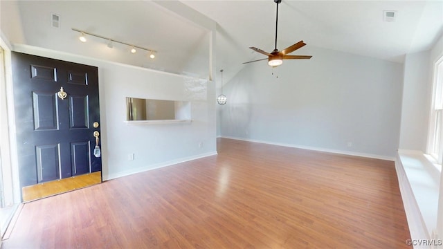 7816 Camolin Ct, Henrico, VA 23228 - unfurnished living room featuring rail lighting, ceiling fan, wood finished floors, and vaulted ceiling