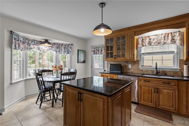 5307 Dermotte Ln, North Chesterfield, VA 23237 - kitchen with stainless steel dishwasher, brown cabinetry, tasteful backsplash, glass insert cabinets, and pendant lighting