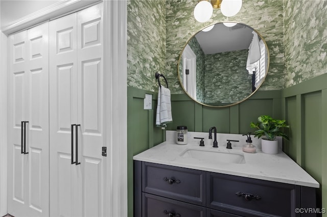 5307 Dermotte Ln, North Chesterfield, VA 23237 - bathroom featuring wallpapered walls, vanity, a decorative wall, a closet, and wainscoting