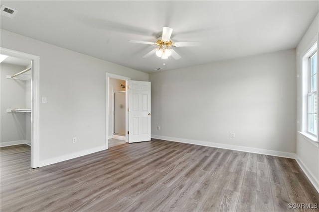 11219 Mill Place Ter, Glen Allen, VA 23060 - unfurnished bedroom featuring wood finished floors, a spacious closet, and ceiling fan