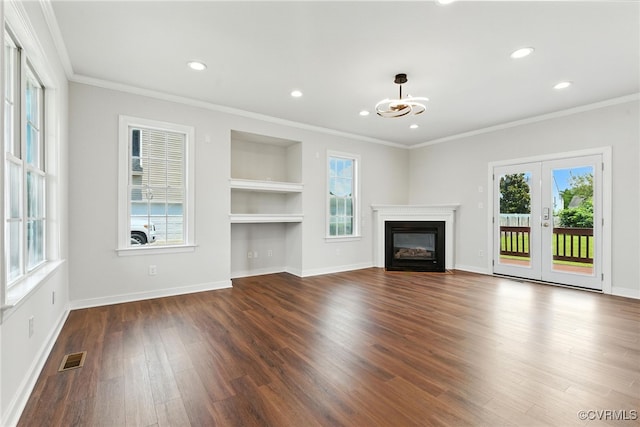 11219 Mill Place Ter, Glen Allen, VA 23060 - unfurnished living room featuring dark wood-style floors, crown molding, built in features, recessed lighting, and a glass covered fireplace