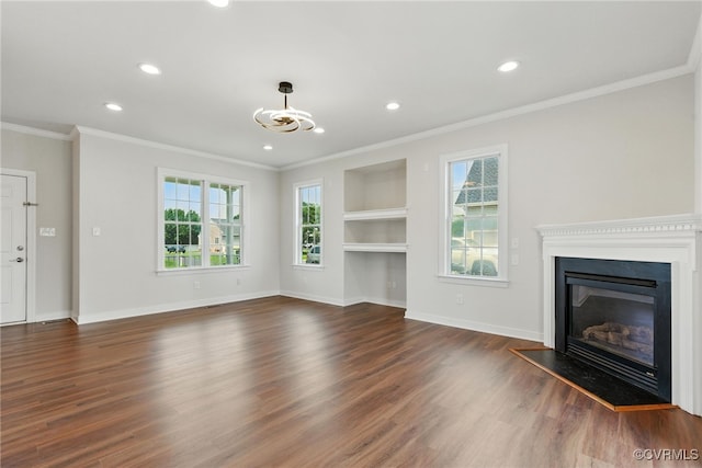 11219 Mill Place Ter, Glen Allen, VA 23060 - unfurnished living room featuring ornamental molding, recessed lighting, dark wood finished floors, a glass covered fireplace, and built in shelves
