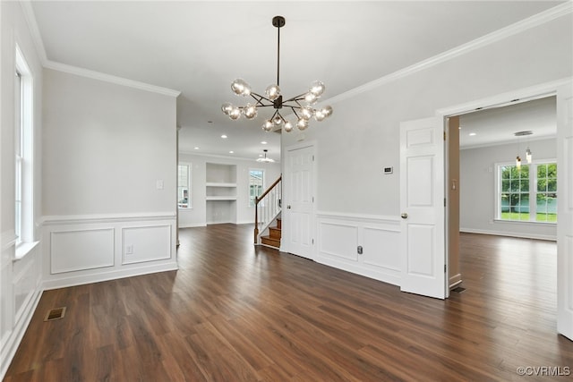 11219 Mill Place Ter, Glen Allen, VA 23060 - empty room featuring a chandelier, ornamental molding, stairway, dark wood-style floors, and wainscoting