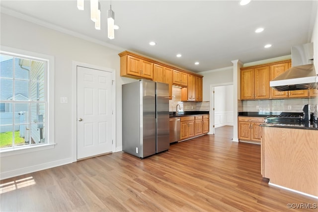 11219 Mill Place Ter, Glen Allen, VA 23060 - kitchen with stainless steel appliances, crown molding, wall chimney exhaust hood, dark countertops, and backsplash