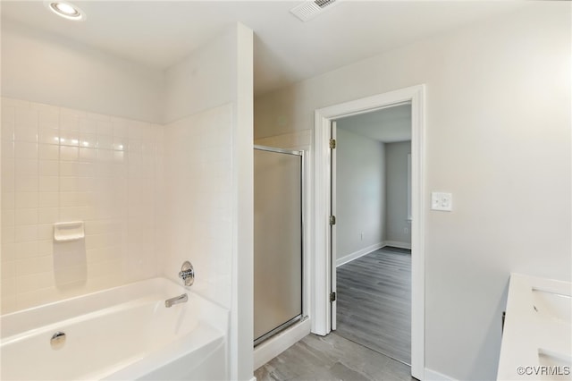 11219 Mill Place Ter, Glen Allen, VA 23060 - full bath with a shower with shower door, a tub to relax in, vanity, wood finished floors, and recessed lighting