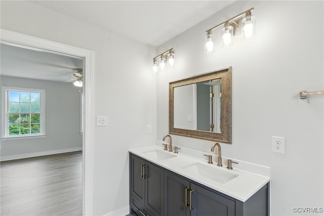 11219 Mill Place Ter, Glen Allen, VA 23060 - full bathroom with double vanity, ceiling fan, and wood finished floors