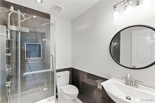 11219 Mill Place Ter, Glen Allen, VA 23060 - full bath with tile walls, vanity, a wainscoted wall, a stall shower, and recessed lighting