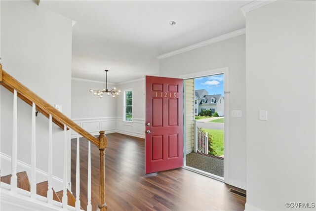 11219 Mill Place Ter, Glen Allen, VA 23060 - foyer entrance with wood finished floors, a chandelier, stairs, crown molding, and a wainscoted wall
