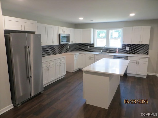 827 Ruthers Rd, North Chesterfield, VA 23235 - kitchen with appliances with stainless steel finishes, white cabinetry, tasteful backsplash, and recessed lighting