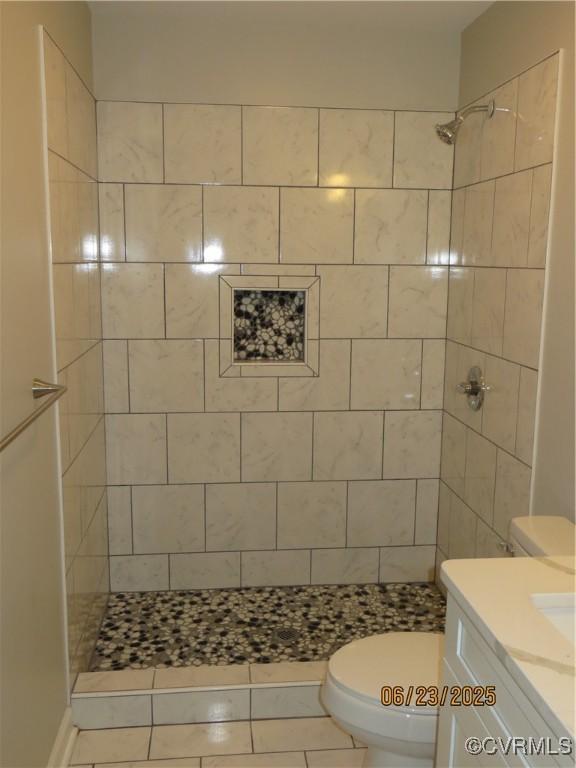 827 Ruthers Rd, North Chesterfield, VA 23235 - full bath with a tile shower, vanity, and tile patterned floors