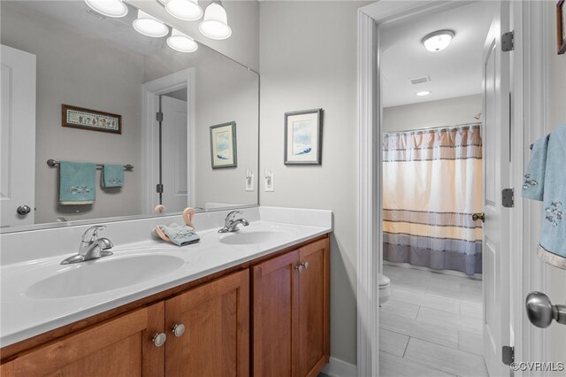 1638 Olde Links Dr, Powhatan, VA 23139 - bathroom featuring double vanity and a shower with curtain